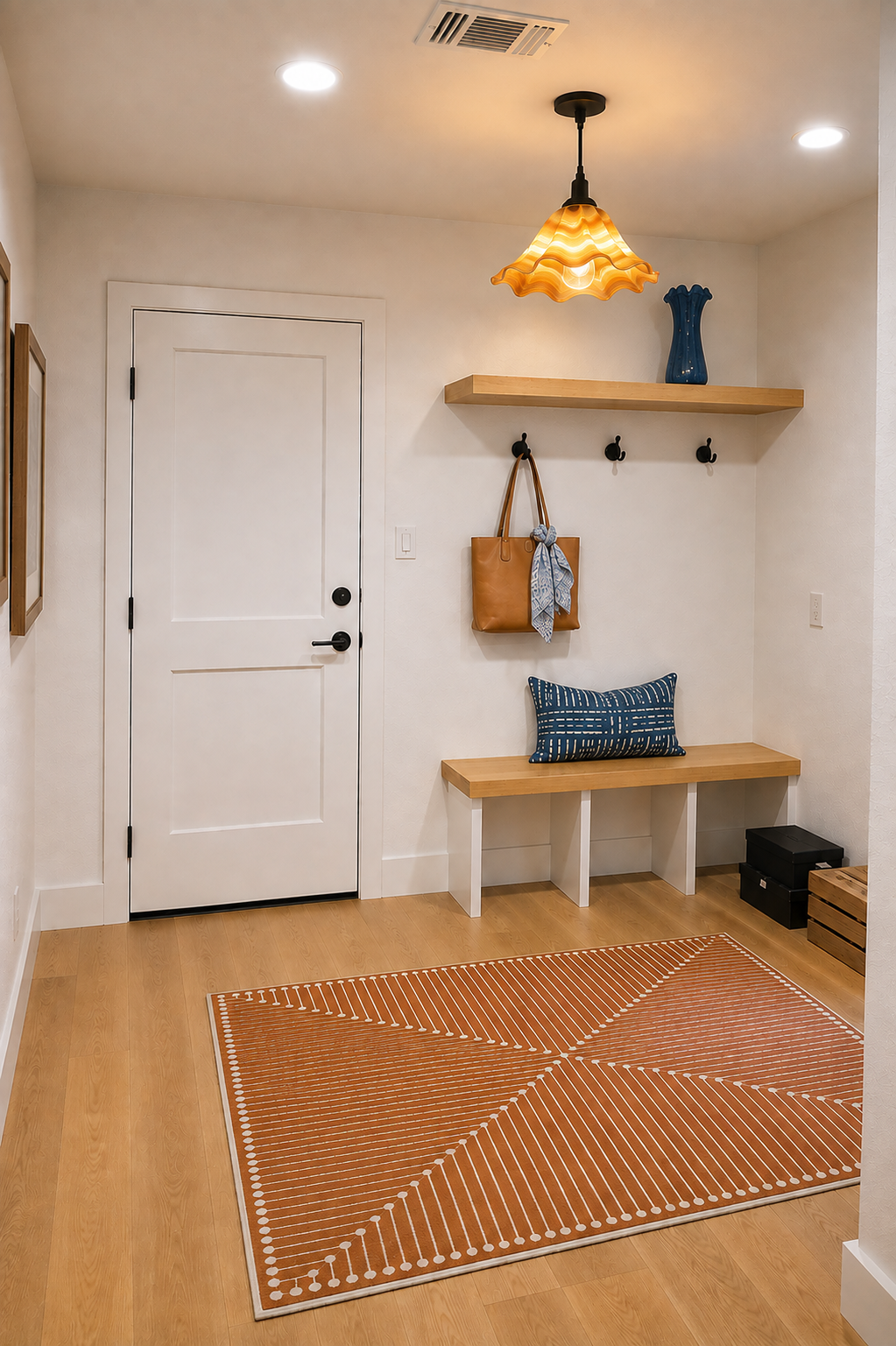 Hollywood Park mudroom entrance with wood bench, floating shelf and amber pendant light